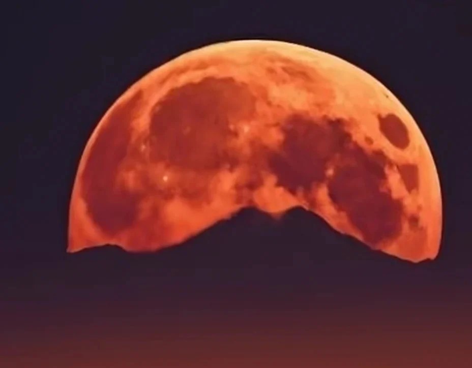 "Blood Moon over Rocky Mountains" image via https://www.craiyon.com/en/image/HSMOglWwRYCUunpNvaalNA